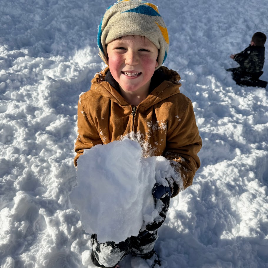 Student holds a giant snowball